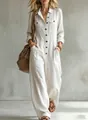 Elegant white linen long-sleeve jumpsuit with wide-leg design and button-up front. - S / Top And Bottom / White