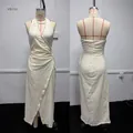 Detailed front and back view of a white halter neck wrap maxi dress on a mannequin - XS / Dresses / Milky White