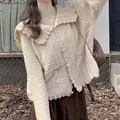 Detail of sweet style knitted cardigan with hollow lace doll collar in cream - One Size / Tops / Khaki