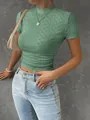 Detailed view of women's green knit crop top with diamond textured patterns - S / Tops / Green
