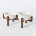 Double elevated white ceramic pet bowls with embossed paw prints on a sturdy dark wooden stand - Medium Embossed Paw Bowls (Short+High) + Dual Acacia Wood Stand