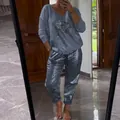 Casual two-piece women's lounge set with sequin eye graphic top and metallic pants - Navy Blue