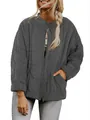 Detail view of women's loose grey quilted jacket with stand collar and gold zipper - S / Tops / Dark Gray