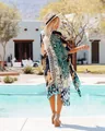 Back view of a vibrant chiffon floral printed kimono cover-up styled for a resort pool day - Tops / One Size / Black