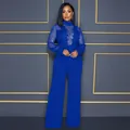 Elegant royal blue sequin lace sheer jumpsuit with high neck and wide leg trousers. - S / Jumpsuits / Blue