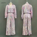 Front and back view of purple paisley print long-sleeve shirt and wide-leg trousers set - S / Top And Bottom / Purple Print