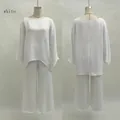 Vue de face et de dos de l'ensemble élégant blouse ample et pantalon large blanc - S / Haut Et Bas / Blanc