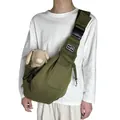 Detailed view of olive green breathable pet sling carrier bag worn by a male model. - Army Green