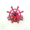 Close-up view of a pink bird cage ship wheel toy with colorful rolling beads for parrots - Round Head Pink (Colorful Beads)