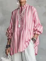 Detailed macro view of women's pink striped loose shirt featuring ruffled collar and sleeves - S / Tops / Pink