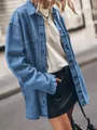 Detailed side view of an oversized vintage blue denim shirt with large utility pockets - S / Tops / Blue