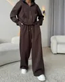 Detailed view of women's brown two-piece tracksuit with zip-up hoodie and wide-leg pants - S / Top And Bottom / Coffee