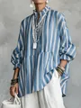 Close-up of women's blue and white striped loose blouse with casual lantern sleeves - S / Tops / Blue