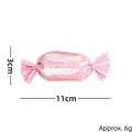 Rosa glänzendes Katzenminze-Spielzeug in Bonbonform, 11 cm Länge und ca. 6 g Gewicht. - Rosa Süßigkeit