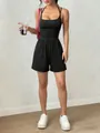 Vue détaillée d'une élégante combinaison d'été noire à licou avec un short large - XS / Haut Et Bas / Noir
