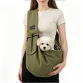 Green quilted portable pet sling carrier bag for small dogs and cats shown on model - Army Green