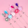 Bacchetta per gatti con fiore di peluche, piume e campanelli in cinque colori - Girasole