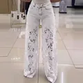 Women's high-waisted wide-leg jeans with elegant white lace patchwork design - XS / White