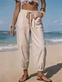 Stylish striped summer jogger pants for women featuring a functional drawstring waist and pockets. - Beige