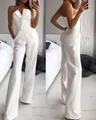 Detailed view of an elegant white strapless wide-leg jumpsuit for women in bedroom - S / Jumpsuits / White
