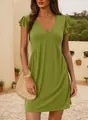 Detail view of a green casual V-neck dress with ruffle sleeves in a summer setting - S / Grass Green