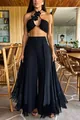 Full view of elegant black high-waisted wide-leg trousers with fringe hem detailing - S / Bottoms / Black