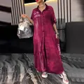 Macro view of burgundy denim shirt dress featuring white fashion letter print and collar - S / Dresses / Red
