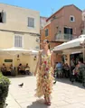 Elegant floral chiffon maxi dress with ruffles shown in a sunny outdoor setting - S / Dresses / Yellow