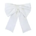 Detailed view of a stylish white oversized bow-shaped bandeau top in soft fabric - S / Tops / White