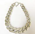 Macro view of a durable chunky silver-toned metal curb chain collar for pet dogs - S / Silver