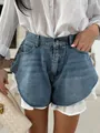 High-waisted blue washed denim shorts featuring a stylish white ruffle hem detail - S / Bottoms / Denim Blue