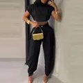 Elegant black two-piece outfit featuring a crop top and pleated high-waisted trousers. - XS / Top And Bottom / Black