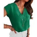 Detail view of women's elegant dark green V-neck sleeveless blouse with subtle crepe texture - Green