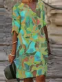 Macro detail showing the vibrant abstract floral pattern and V-neckline of this vintage dress. - S / Dresses / Pattern 20
