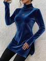 Detailed view of the royal blue velvet fabric and side slit of the high-neck turtleneck top. - S / Tops / Sapphire Blue