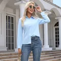 Modern light blue long sleeve button-up shirt for women in a stylish casual outdoor setting - S / Tops / Sky Blue