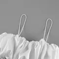 Close-up of a white satin camisole top showing the thin straps and elegant gathered pleated texture - S / Tops / White