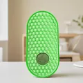 Bright green silicone cat self groomer with honeycomb texture and built-in catnip ball - Green