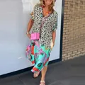 Close-up detail of women's stylish V-neck loose dress featuring leopard and tropical prints - S / Dress (18919) / Leopard Print