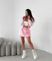 Close-up of pink and white color-block tracksuit set with zip-up jacket and mini skirt - Pink and White