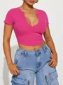 Detail view of hot pink ribbed knit crop top with deep V-neckline and short sleeves - S / Tops / Rose Red