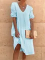Detail shot of light blue cotton linen midi dress featuring puff sleeves and V-neckline - S / Dresses / Light Blue