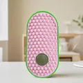 Oval pink cat face scratcher featuring a catnip ball and soft honeycomb textures - Pink