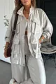 Detail view of silver metallic long-sleeved jacket featuring oversized cargo pockets - S / Top And Bottom / Silver