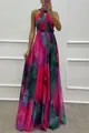 Full length view of vibrant floral print maxi dress featuring a halter neck and flowing skirt - S / Dresses / Pink