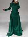 Detailed view of the dark green sequin bodice and elegant satin skirt of this evening gown - Green