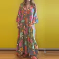 Detail of a floral print long-sleeve maxi dress with loose silhouette and V-neck. - S / Dresses / As Shown
