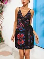 Chic floral print V-neck camisole wrap dress against a Mediterranean wall background - S / Dresses / Black