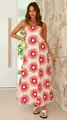 Close-up detail showing the vibrant red sunburst print on this strapless maxi vacation dress - S / Dresses / Rice White (Sunburst Print)