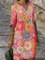 Detailed view of women's colorful floral print V-neck dress with abstract patterns. - S / Dresses / Multicolor Floral and Polka Dot Print